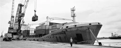  ?? REUTERS ?? A container ship being loaded at the container terminal at the Cochin Port. Mega trade agreements are increasing­ly determinin­g the course of world trade