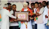  ?? — PTI ?? Prime Minister Narendra Modi receives a memento during a public rally ahead of the Karnataka Assembly elections in Tumakuru on Saturday.