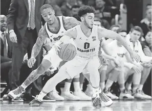  ?? NUCCIO DINUZZO/USA TODAY SPORTS ?? Marquette guard Markus Howard, dribbling against DePaul’s Jaylen Butz, is averaging 25.6 points per game.