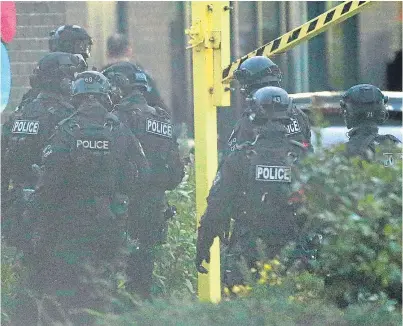  ?? PA. ?? Police at the scene in Bermuda Park, Nuneaton, where a gunman held two people hostage.