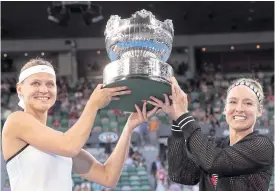  ??  ?? Bethanie Mattek-Sands, right, and Lucie Safarova hold their trophy aloft.