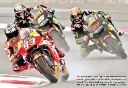  ??  ?? AKSI Pelumba Pasukan Repsol Honda Marc Marquez (depan) pada sesi latihan bebas kedua MotoGP Grand Prix Motosikal Malaysia di Litar Antarabang­sa Sepang pada Jumaat. -Gambar Bernama