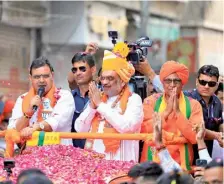  ?? FILE PHOTO ?? Union Home Minister Amit Shah along with Rajasthan Chief Minister Bhajan Lal Sharma (left) during a roadshow in Sikar.