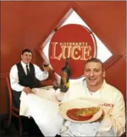  ?? PETER HVIZDAK — NEW HAVEN REGISTER ?? Ristorante Luce chef/owner Paul Iannaccone, right, and floor manager Edwin Picado show off their soffritto.