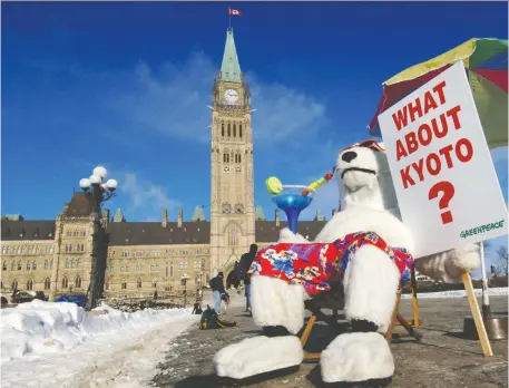  ?? Ashley Fraser/Files ?? Greenpeace activists were on Parliament Hill a decade ago to ask then prime minister Stephen Harper whether his government intended to meet Canada’s commitment­s under the Kyoto Protocol. In 2011, Canada abandoned its targets under the plan.