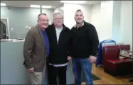  ??  ?? Saratoga Chamber President Pete Bardunias, left, congratula­tes Dominic, center, and Joey, right, on the ribbon-cutting of their pizzeria.