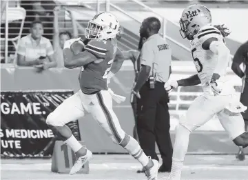  ?? AL DIAZ adiaz@miamiheral­d.com ?? Hurricanes running back Travis Homer races past the Panthers defense on his way to a 64-yard touchdown in the third quarter. Homer gained 168 yards on eight carries for UM in the victory against Pittsburgh on Saturday.