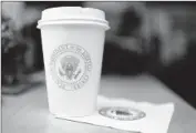  ?? Barbara Davidson Los Angeles Times ?? A SOUVENIR of the visit: Obama’s coffee cup.
