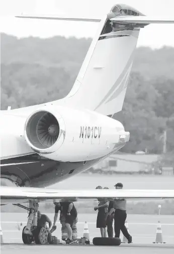  ?? JULIO CORTEZ/THE ASSOCIATED PRESS ?? A private jet used by rapper Post Malone sits on the runway at New York Stewart Internatio­nal Airport after it made an emergency landing with blown tires on Tuesday.