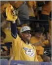  ?? MARK HUMPHREY — ASSOCIATED PRESS ?? Country music star Hank Williams Jr. waves the rally towel before the start of Game 3 Stanley Cup Finals last week in Nashville, Tenn.