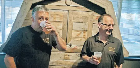  ?? LEWIS KELLY ?? President Don Paré, left, and chief financial officer Alvin Gordon sample suds they create at Ribstone Creek Brewery.