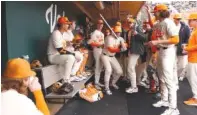  ?? TENNESSEE ATHLETICS PHOTO ?? First baseman Blake Burke, shown as the center of attention in Tennessee’s dugout, homered twice Sunday afternoon as the Volunteers blanked Dayton 6-0 and improved to 6-2.