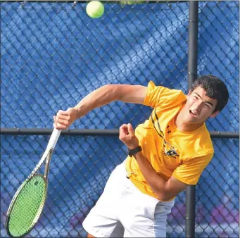  ?? STAFF PHOTO CHRIS CHRISTO — BOSTON HERALD ?? Lexington’s Joel McCandless serves to Paul Neal of St. John’s Prep during their Division 1 semifinal match. Lexington captured a tough 3-2 victory.