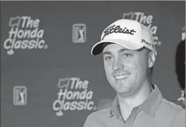  ?? Alan Diaz / The Associated Press ?? Justin Thomas smiles as he talks to reporters at the Honda Classic golf tournament practice Wednesday in Palm Beach Gardens, Fla.