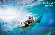  ??  ?? Surfing at Niyama