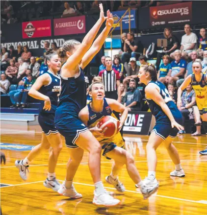  ?? Picture: Greenhouse Media Production ?? Townsville Flames’ point guard Steph Reid takes on the BA COE defence.