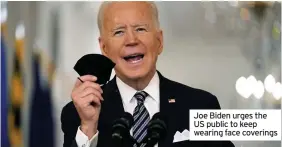  ??  ?? Joe Biden urges the US public to keep wearing face coverings