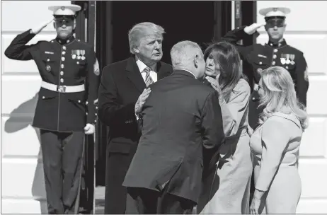  ?? EVAN VUCCI/AP PHOTO ?? President Donald Trump and first lady Melania Trump greet Israeli Prime Minister Benjamin Netanyahu and his wife, Sara Netanyahu, at the White House in Washington on Monday.