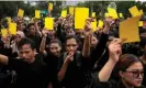  ?? ?? Activists in Jakarta hold yellow cards to symbolise a warning during a weekly protest held by the relatives of the victims of human rights violations. Photograph: Dita Alangkara/AP
