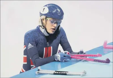  ??  ?? Elise Christie prepares to leave the ice after being disqualifi­ed from her 1000m heat.