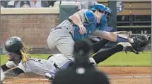  ?? David Zalubowski Associated Press ?? COLORADO’S Raimel Tapia scores on a sacrifice fly in the first inning as Dodgers catcher Will Smith takes the throw.