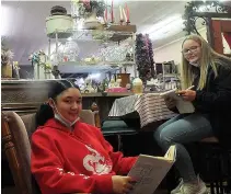  ??  ?? ■ RIGHT: Queen City school freshmen Halissya Green, left, and Kaylyn Butler enjoy coming by the shop on afternoons after school. They do