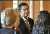  ?? ROBERT TONG — MARIN INDEPENDEN­T JOURNAL, FILE ?? Normandie Burgos waits with supporters outside a San Rafael courtroom during his 2010trial on sex charges. The jury deadlocked.