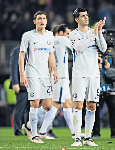  ??  ?? All over: Alvaro Morata and his Chelsea teammates applaud their fans at the Nou Camp