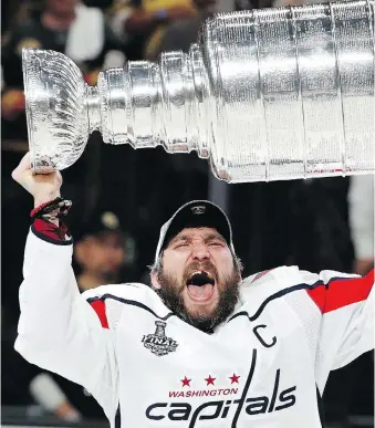  ?? JOHN LOCHER/THE ASSOCIATED PRESS ?? Alex Ovechkin’s post-Stanley Cup celebratio­n promises to continue well into the summer, but then it’s on to business and preparing for fatherhood.