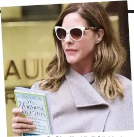  ??  ?? Fan: Trinny Woodall with Erika’s book