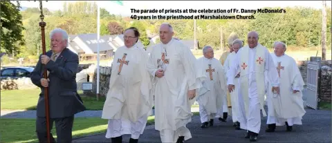  ??  ?? The parade of priests at the celebratio­n of Fr. Danny McDonald’s 40 years in the priesthood at Marshalsto­wn Church.