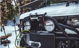  ??  ?? 02. A U-Joint Offroad front bumper houses a Warn VR10 winch, an Agency 6 fairlead and billet winch shackle, and Lightforce HTX2 lights. The top of the bumper holds the Agency 6 shovel with mega mount device.