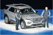  ?? Picture: BILL PUGLIANO/GETTY IMAGES ?? SUV FOCUS: Ford president and CEO Jim Hackett, right, and president of global operations Jim Farley at the reveal of the new 2020 Ford Explorer SUV at Ford Field in Detroit, Michigan, on Wednesday