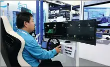  ?? CHEN WEI / XINHUA ?? An employee from a participat­ing enterprise demonstrat­es a pilotless remote cockpit during the 2023 Global Industrial Internet Conference in Shenyang, Liaoning province, on Oct 18.