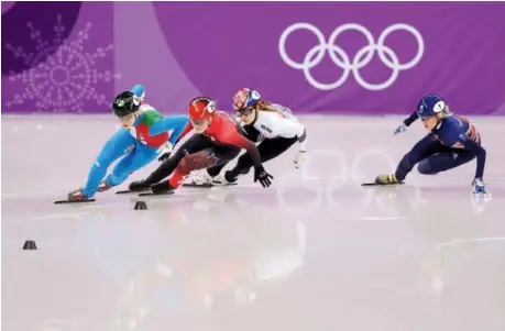  ?? Richard Heathcote/Getty Images ?? Arianna Fontana of Italy, left, Kim Boutin of Sherbrooke, Que., Minjeong Choi of South Korea and Great Britain’s Elise Christie compete in the women’s 500-metre short-track speedskati­ng final Tuesday at Gangneung Ice Arena. Choi was later disqualifi­ed.