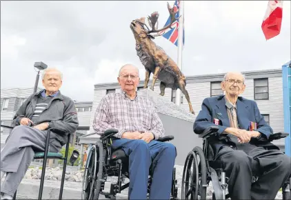  ?? GLEN WHIFFEN/THE TELEGRAM ?? James Samuel Miller, 81, of C.B.S., who served with the Royal Canadian Air Force, sits Tuesday afternoon between Second World War veterans James Kirby of St. John’s (left) and George T. Hudson of St. John’s, both 94. The veterans were admiring the new...