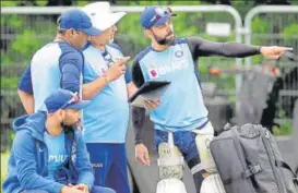  ?? ANI ?? Indian skipper Virat Kohli talks to bowling coach Bharat Arun during training in Christchur­ch.
■