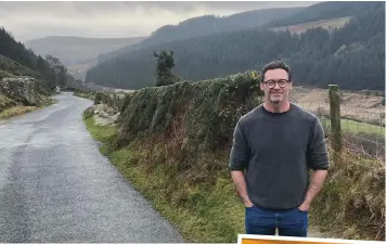  ?? ?? Beautiful views: Actor Hugh Jackman takes in Glendaloug­h and other scenery in Co. Wicklow and enjoys a Guinness, right