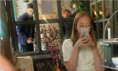  ??  ?? ●● Robert Pattinson stood up in the background while Amy Robison and her cousin dined in Richmond Tea Rooms