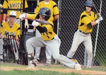  ?? Dave Phillips / Hearst Connecticu­t Media ?? Amity centerfiel­der A.J. Soldra bunts for a base hit in the sixth inning on May 23.