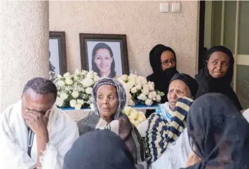  ??  ?? Relatives and friends of Sara Gebremicha­el, 38, a senior hostess and a crew leader on the Ethiopian Airlines Flight ET 302 plane that crashed, mourn at her house in Addis Ababa, on Monday. — Reuters