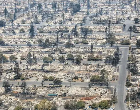  ?? Marcus Yam Los Angeles Times ?? A VIEW of the destroyed neighborho­od of Coffey Park in Santa Rosa. Around town, hotels were packed with people who lost their homes.