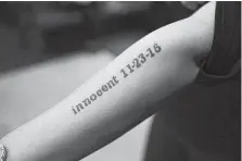  ?? Jerry Lara / Staff photograph­er ?? Cassandra Rivera shows her tattoo before Monday’s proceeding. She and three others were officially exonerated on Nov. 23, 2016.