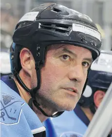  ?? JEFFREY T. BARNES/ASSOCIATED PRESS ?? Mike Lesakowski was the driving force behind an 11-day-long hockey game that began in June, raising US$1.2 million for cancer research. A group of 40 mostly 40-somethings from the Buffalo, N.Y., area played the game in four-hour shifts.