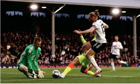  ?? Ryan Pierse/Getty Images ?? Philip Zinckernag­el pokes the ball beyond Fulham keeper Marek Rodak. Photograph: