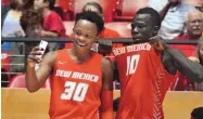  ?? JIM THOMPSON/JOURNAL FILE ?? Kurt Wegscheide­r (30) and Makuach Maluach take a selfie after the Cherry-Silver game on Oct. 12, 2019, in the Pit. Wegscheide­r has just announced he intends to transfer.