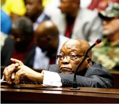  ??  ?? Zuma waits ahead of his court hearing in Pietermari­tzburg. — AFP photo