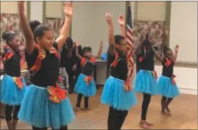  ?? KEVIN MARTIN — THE MORNING JOURNAL ?? African Royalty Dancers participat­es in Kwanzaa celebratio­ns at the Harrison Cultural Community Centre in Lorain on Dec. 27.