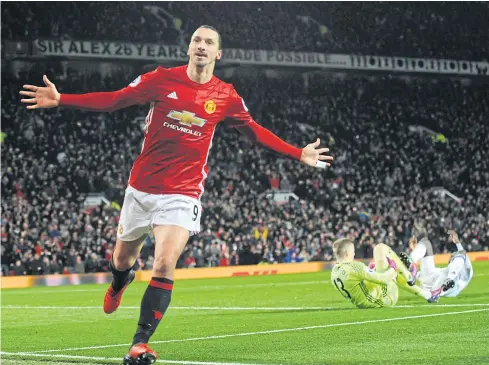  ??  ?? Swedish striker Zlatan Ibrahimovi­c celebrates after scoring a goal for Manchester United.