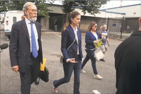  ?? Ned Gerard / Hearst Connecticu­t Media ?? Michelle Troconis leaves the State Police Troop G barracks in Bridgeport after turning herself in to face additional charges in the Jennifer Dulos case on Thursday.